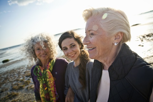 Three women from different generations on the beach 