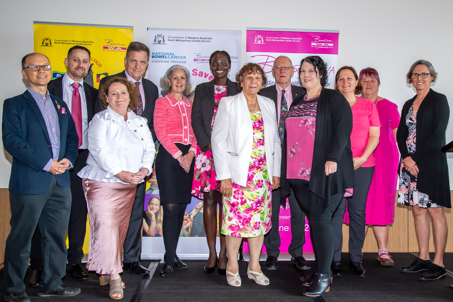 VIP guests at Pink Ribbon Breakfast standing for group photo