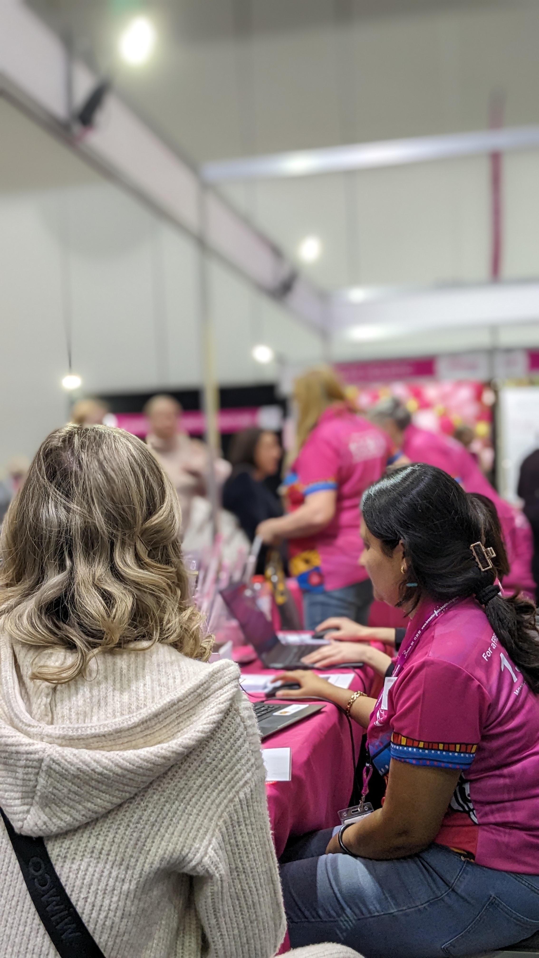 Client being booked in by a breastscreen wa staff member at everywoman expo