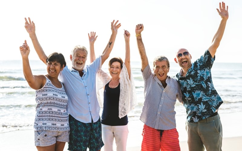 People over 55 celebrating at the beach