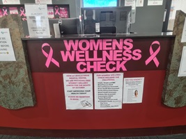 Reception desk decorated with Womens Wellness Checks letters
